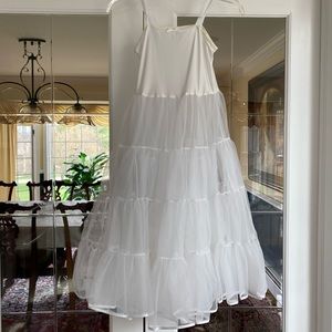 Child’s full crinoline petticoat. Color is white. Size 8